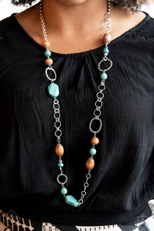 Prairie Reserve - Blue Turquoise - Silver - Wood Necklace - Paparazzi Accessories - Assortment of turquoise stones, wooden beads, and silver accents sporadically adorn a double-linked silver chain, creating an earthy display across the chest.