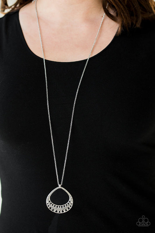 Prehistoric Drama - Silver Fashion Necklace - Paparazzi Accessories - A textured silver teardrop pendant swings from the bottom of a lengthened silver chain for a funky tribal look. Features an adjustable clasp closure. Sold as one individual necklace.