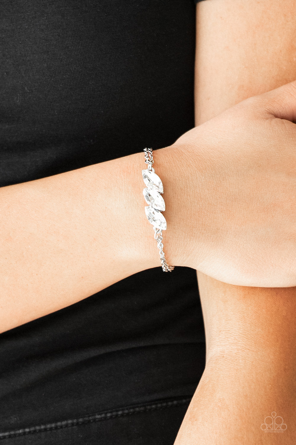 Pretty Priceless - White and Silver Bling Bracelet - Paparazzi Accessories - Featuring regal marquise-cuts, a trio of glittery white rhinestones join across the center of the wrist for a timeless look. Features an adjustable clasp closure. Sold as one individual bracelet.