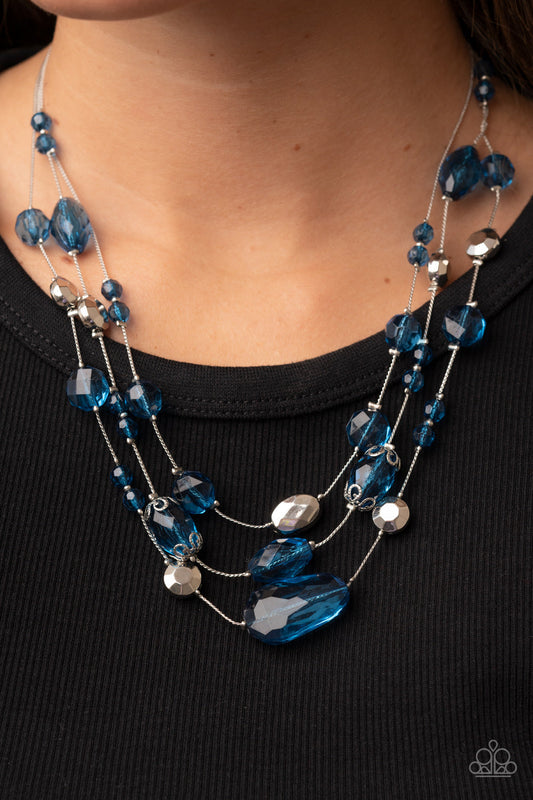 Prismatic Pose - Mykonos Blue and Silver Necklace - Paparazzi Accessories - Variety of faceted silver beads and Mykonos Blue crystal-like accents are fitted in place along layers of silver wire-like chain, resulting in a prismatic pop of color. Features an adjustable clasp closure fashion necklace. 