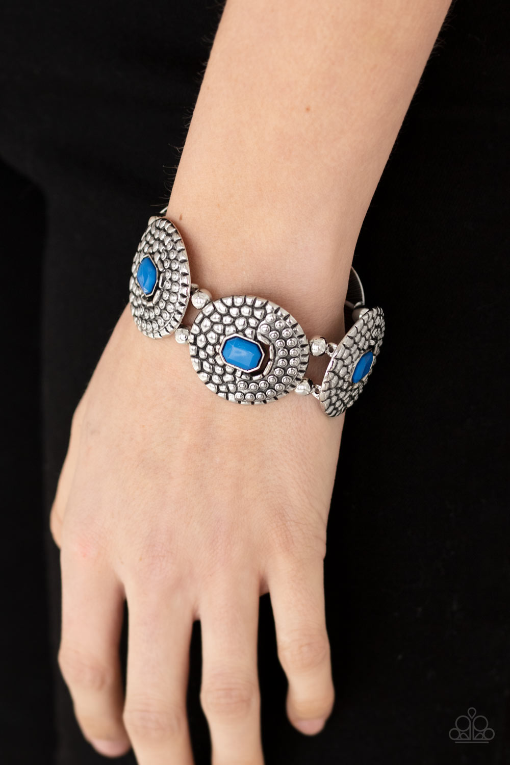 Prismatic Prowl - Blue and Silver Bracelet - Paparazzi Accessories - French Blue emerald shaped beads adorn the centers of round silver discs studded and embossed in metallic croc-like textures. Infused with pairs of silver beads, the decorative frames are threaded along stretchy bands around the wrist for a wild pop of color.