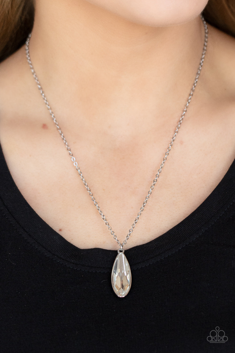 Prismatically Polished - White Gem - Silver Necklace - Encased in a sleek silver fitting, an elongated white teardrop gem swings from the bottom of a classic silver chain below the collar for a timeless elegance. Features an adjustable clasp closure.