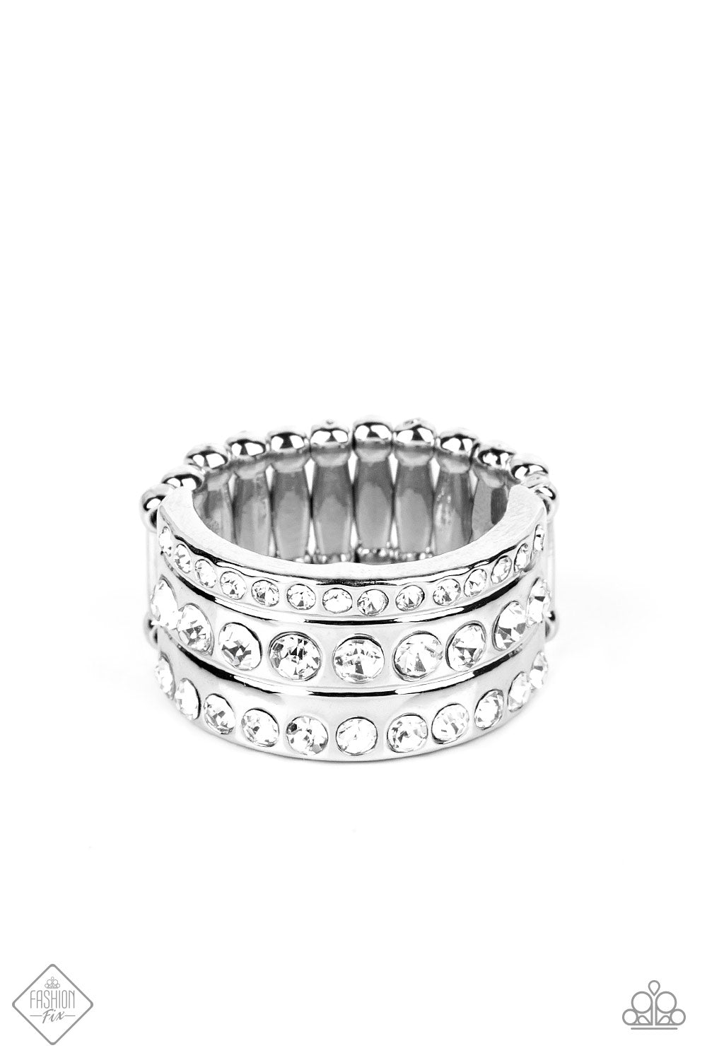 Privileged Poise - White and Silver Fashion Ring - Paparazzi Accessories - A thick band of high-sheen silver is topped with three rows of glittery white rhinestones, creating the illusion of three separate bands. The rhinestones gradually decrease in size from the centermost band, adding depth and dimension to the poised centerpiece. Features a stretchy band for a flexible fit. Sold as one individual ring.