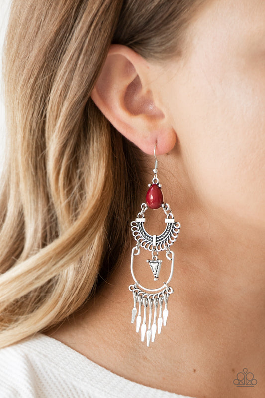 Progressively Pioneer - Red and Silver Earrings - Paparazzi Accessories - A rich red teardrop bead sits atop stacked silver frames that are linked together to allow flowy movement. Featuring tribal inspired patterns, the dramatically stacked frames give way to flared rods for an edgy fringed finish.