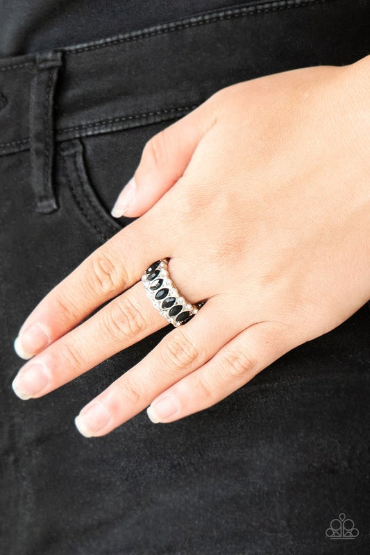 Radical Riches - Black and Silver Ring - Paparazzi Accessories - Regal marquise style cuts, glittery black rhinestones are encrusted down the center of a silver band radiating with glassy white rhinestones for an edgy look. Features a stretchy band for a flexible fit.