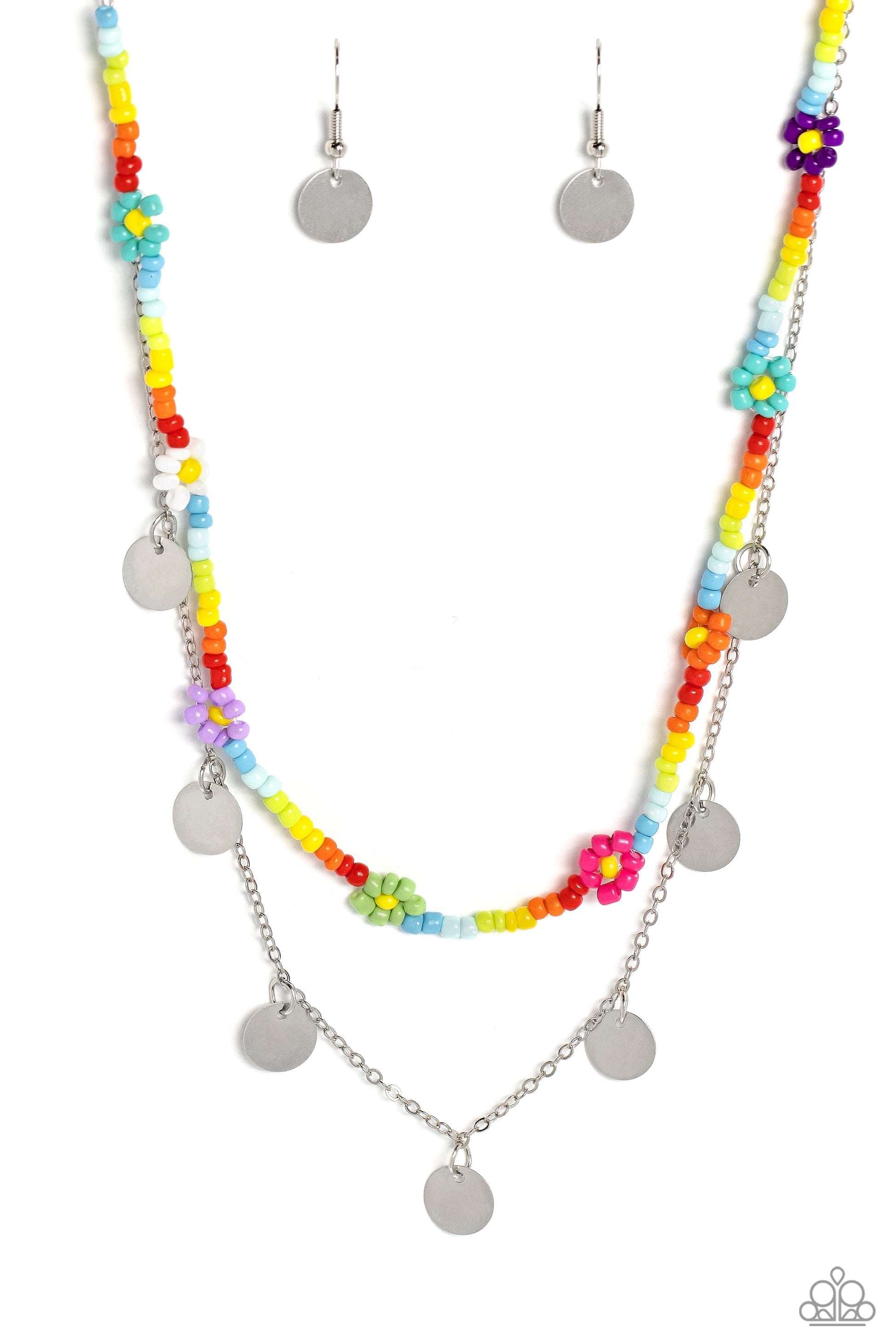Rainbow Dash - Multi Color Necklace - Paparazzi Accessories - Multicolored seed beads are threaded along a wire, falling along the collar in a capricious pattern. Creating additional charm to the design, Pink Peacock, white, purple, blue, orange, green, purple, and baby pink seed bead flowers bloom amongst the bright pops of color. A delicate silver chain, infused with twinkling silver discs, layers with the colorful beads for a sassy, yet sweet, combo.