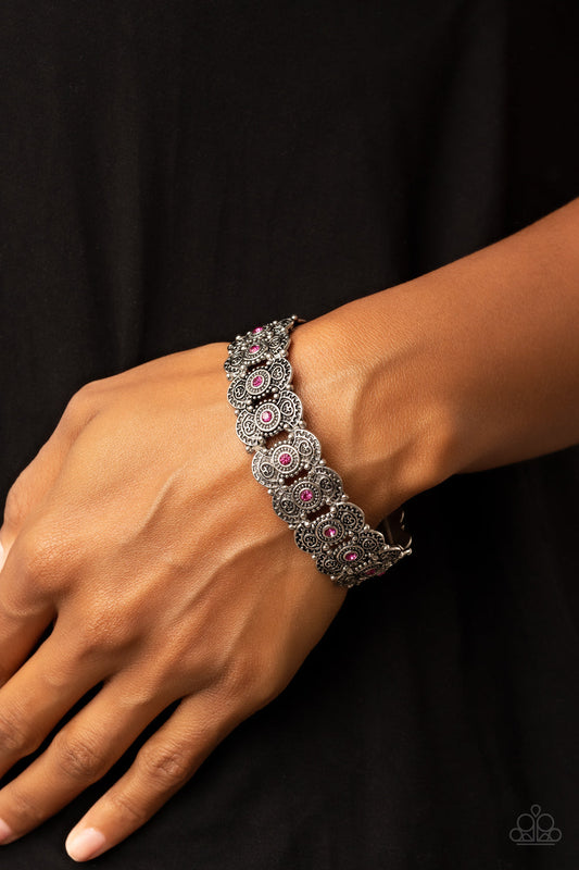 Rapturous Romance - Pink and Silver Bracelet - Paparazzi Accessories - Dotted with sparkly pink rhinestones, pairs of studded and heart embossed patterned silver frames are threaded along stretchy bands around the wrist for a romantic fashion. Sold as one individual bracelet.