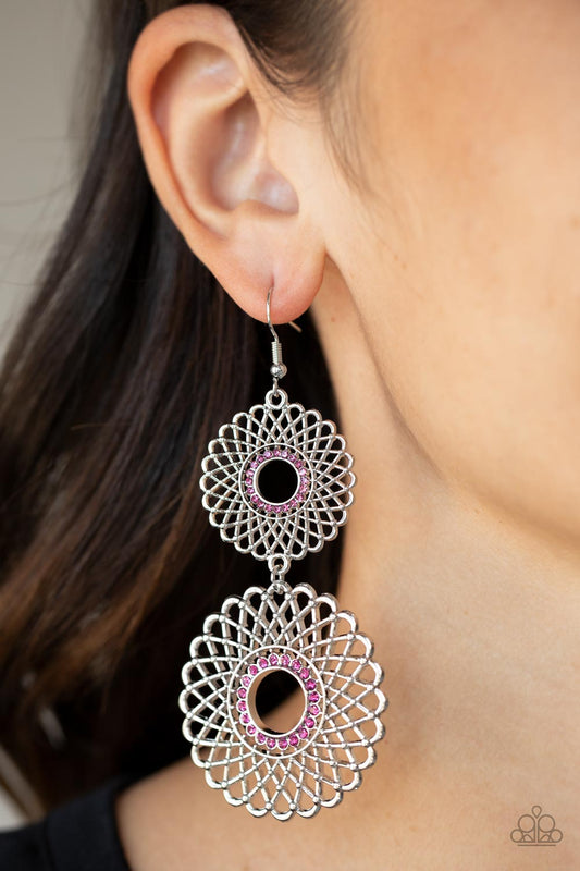 Regal Roulette - Pink - Silver Floral Earrings - Paparazzi Accessories - two dizzying silver floral medallions. Rings of dainty pink rhinestones adorn the center, adding a dash of dazzle. Earring attaches to a standard fishhook fitting. Sold as one pair of earrings.