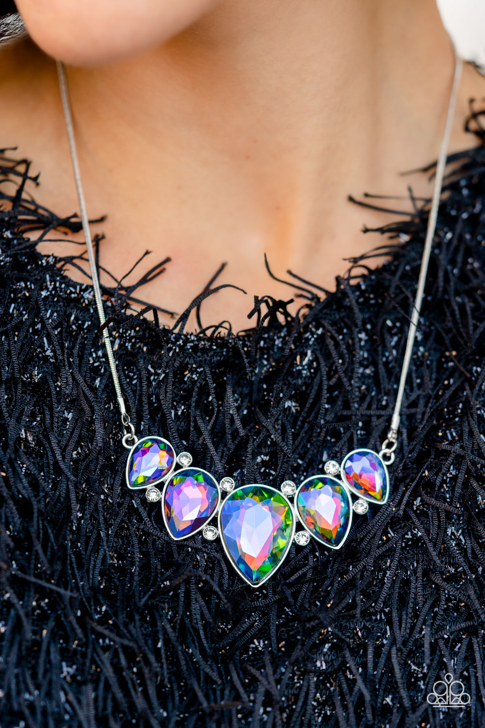 Regally Refined - Multi Color Teardrop Necklace - Paparazzi Accessories - Featuring a stellar UV shimmer, dramatic teardrop gems, gliding from a sleek, silver snake chain, are pressed into high-sheen silver casings, creating a colorful fringe below the collar. Linking each teardrop together, dainty white rhinestones border the tops and bottoms of each shape, creating additional eye-catching dazzle.