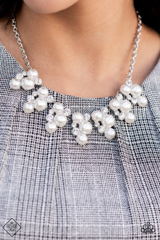 Renown Refinement - White Pearl and Silver Necklace - Paparazzi Accessories - Vivaciously bubbly pearls and glittering white rhinestones flawlessly meld into a row of abstract teardrop frames. The frames delicately connect to classic silver chains, forming a refined ensemble across the collar.