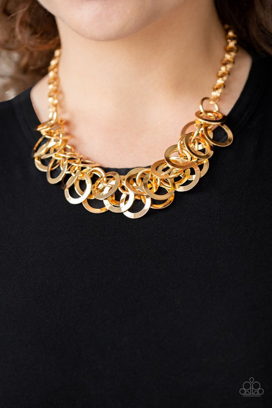 Ringing In The Bling - Gold Necklace - Paparazzi Accessories - Countless shiny gold rings dangle from a shimmery gold chain, creating a clustered fringe below the collar necklace. 