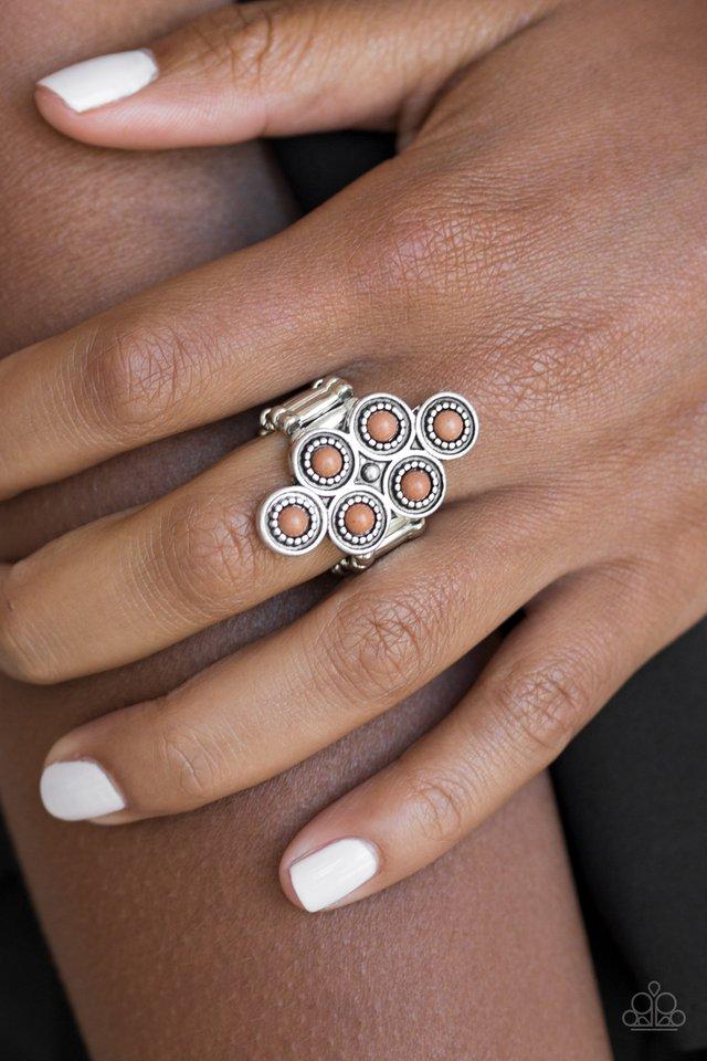 River Rock Rhythm - Brown and Silver Fashion Ring - Paparazzi Accessories - Dainty brown stones are pressed into ornate silver frames, coalescing into an earthy frame atop the finger. Features a stretchy band for a flexible fit.