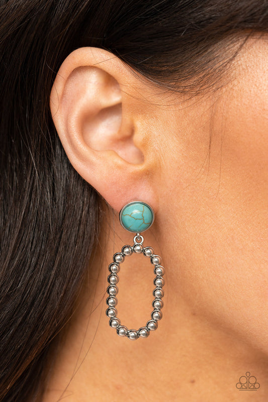 Riverbed Refuge - Blue Turquoise Stone - Silver Earrings - Paparazzi Accessories - Round turquoise stone gives way to a studded oval silver hoop for a rustic flair.