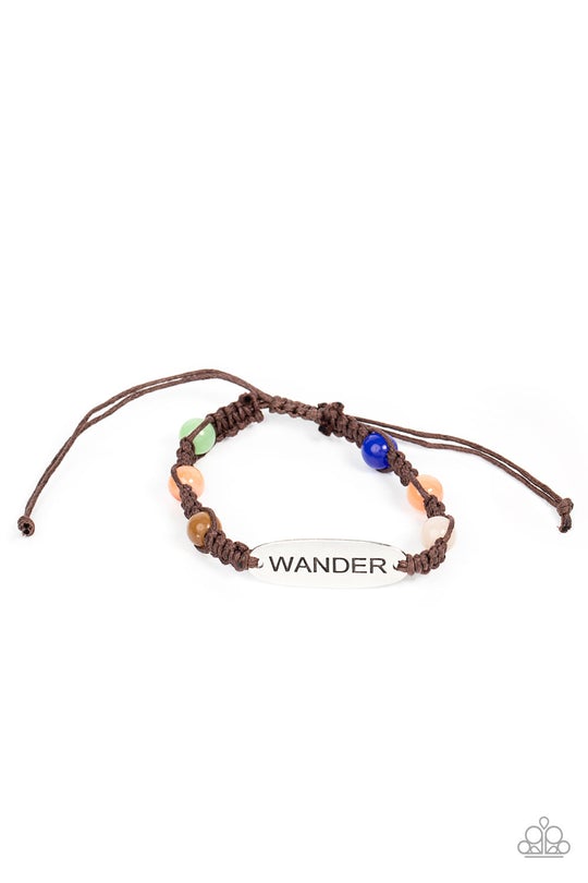 Roaming For Days - Multi Bracelet - Paparazzi Accessories - Glassy multicolored cat's eye stone beads are knotted in place along a strand of braided brown cording that attaches to a silver centerpiece stamped in the word, "Wander," for a free-spirited fashion.