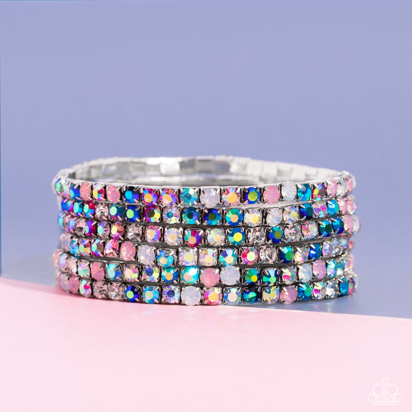 Rock Candy Rage - Multi Color Bracelet - Paparazzi Accessories - Embellished in rhinestone studs, six bracelets threaded along elastic stretchy bands stack across the wrist. Opalescent white, clear, and shades of iridescent in fuchsia, baby pink, and blues create a dramatic collision of color and shimmer. Due to its prismatic palette, color may vary. Sold as set of six bracelets.