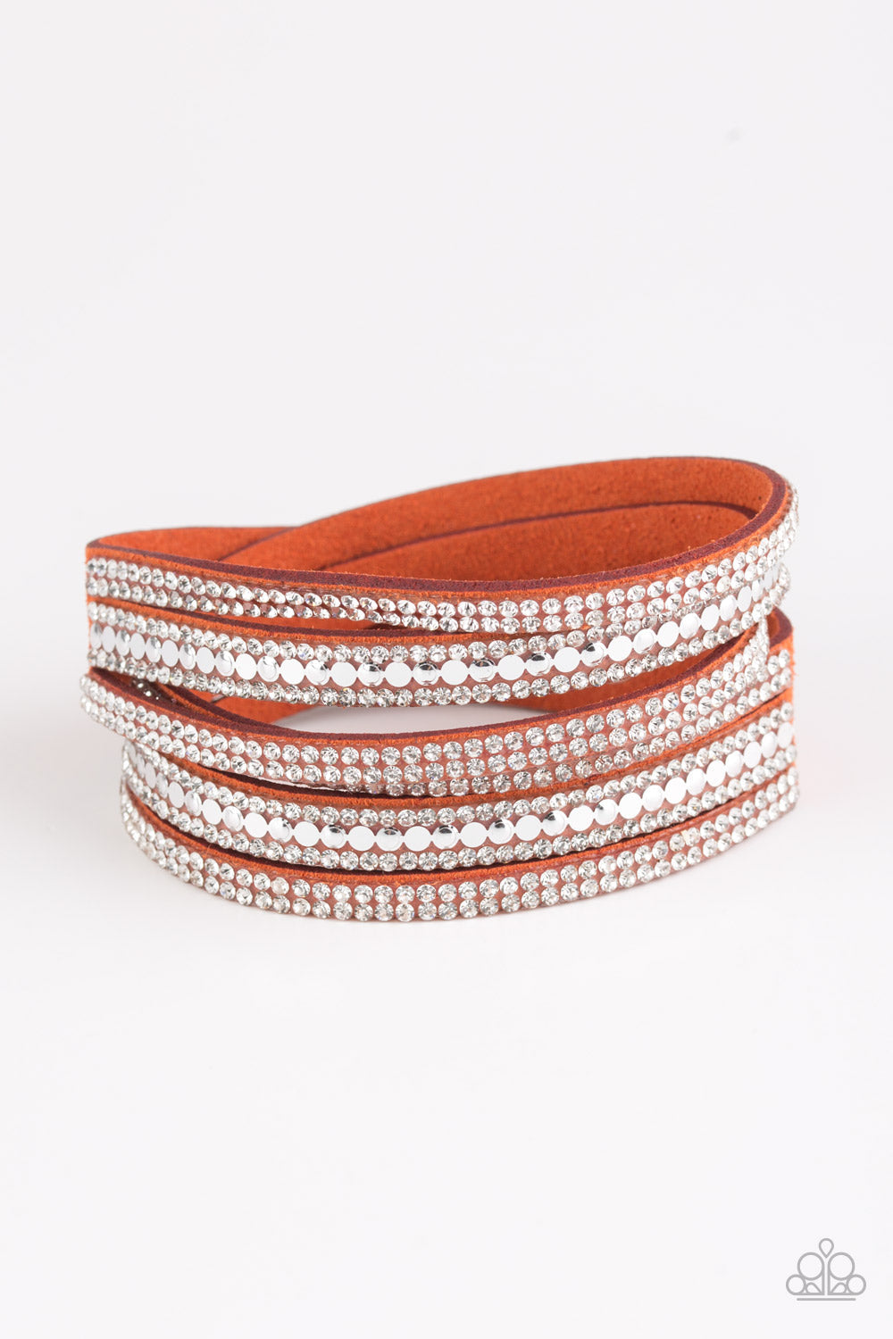 Rock Star Attitude - Orange Suede Wrap - Snap Closure Bracelet - Paparazzi Accessories - Encrusted in rows of glassy white rhinestones and flat silver studs, three strands of Burnt Orange suede wrap around the wrist for a sassy look. The elongated band allows for a trendy double wrap around the wrist. Features an adjustable snap closure. Sold as one individual bracelet.
