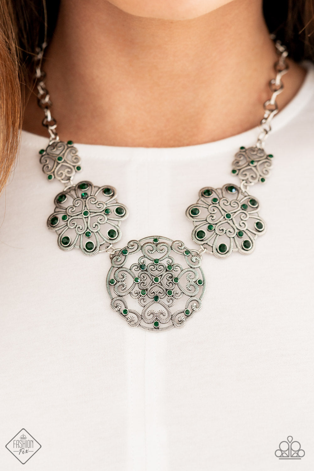 Royally Romantic - Green and Silver Necklace - Paparazzi Accessories - Exquisite heart motifs dotted with dainty emerald rhinestones coalesce into airy medallions that link to a modest silver chain for a stylish fashion necklace. Trendy fashion jewelry for everyone.