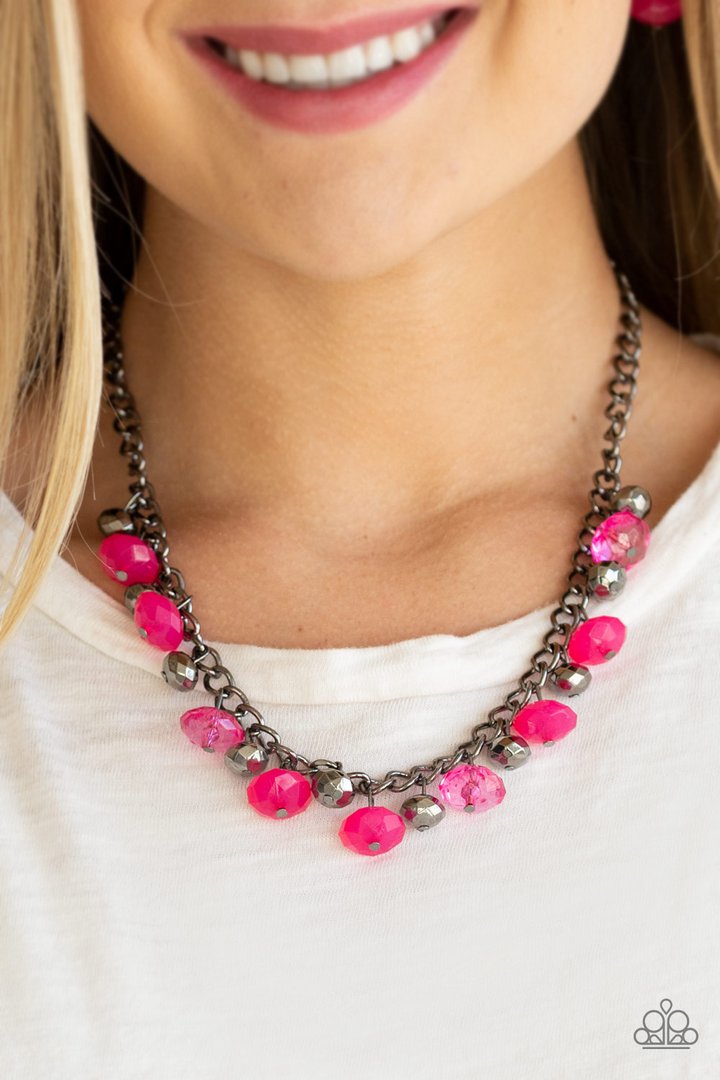 Runway Rebel - Pink - Gunmetal Fashion Necklace - Paparazzi Accessories - Cloudy and glassy finishes, faceted pink crystal-like beads swing from the gunmetal chain. Gunmetal beads join the pink beading, for a flirtatious fringe below the collar fashion necklace.