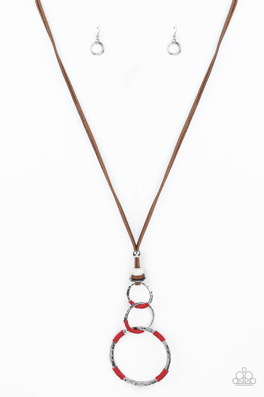 Rural Renovation - Red and Brown Suede Necklace - Paparazzi Jewelry - Wrapped in sections of red threaded accents, a mismatched trio of hammered silver rings link at the bottom of a beaded fitting. The earthy compilation is attached to lengthened strands of brown suede for an authentic finish. Features an adjustable clasp closure. Sold as one individual necklace.