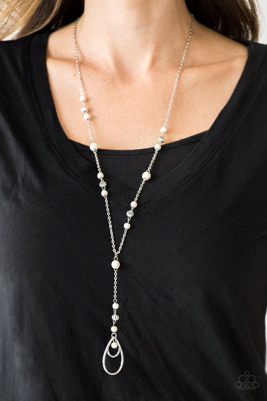 Sandstone Savannahs - White Stone and Silver Necklace - Paparazzi Accessories - Infused with ornate silver beads, earthy white stones trickle along a shimmery silver chain for a seasonal look. A glistening silver teardrop pendant swings from the bottom for a whimsical stylish necklace.