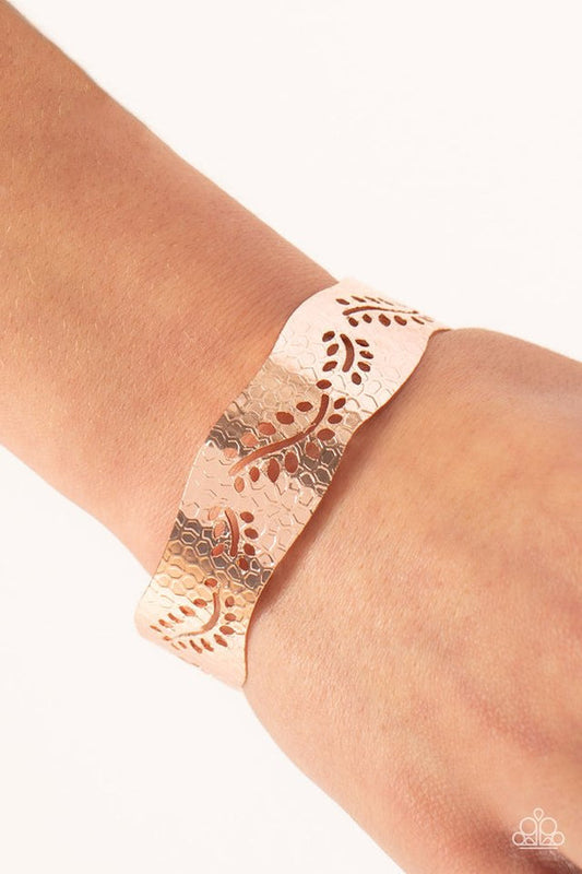 Savanna Oasis - Rose Gold Cuff Bracelet - Paparazzi Accessories - A wavy rose gold cuff is elegantly embossed in an abstract honeycomb texture and stenciled in airy leafy patterns, resulting in a shimmery seasonal centerpiece. Sold as one individual bracelet.