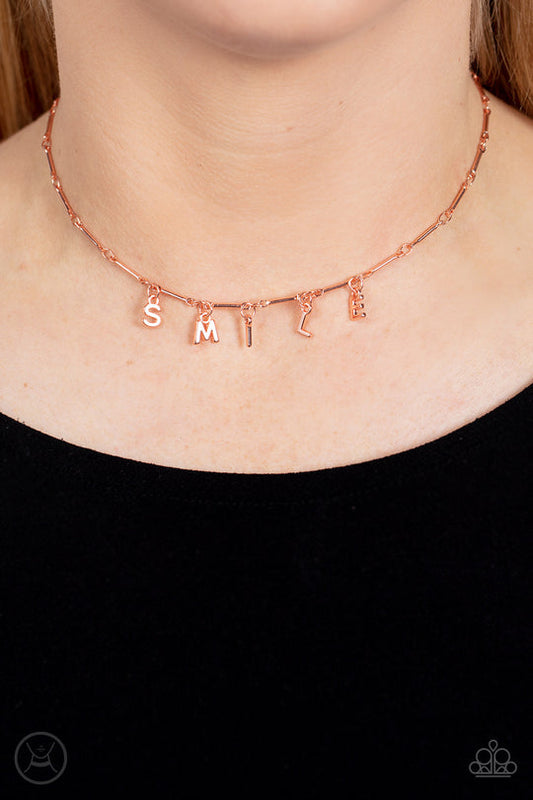 Say My Name - Copper Necklace - Paparazzi Accessories - Separated by dainty copper rods, copper letters spell out the word SMILE in a soft, and simple manner. Features an adjustable clasp closure.