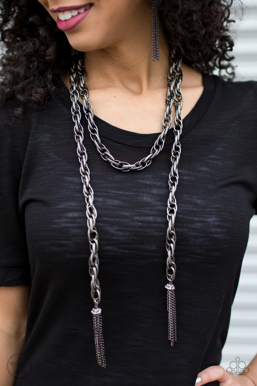 SCARFed for Attention - Gunmetal Scarf Necklace - Paparazzi Accessories - A single strand of spiraling, interlocking links with light-catching texture is anchored by two tassels of chain that add dramatic length to the piece. Undeniably the most versatile piece in Paparazzi's history, the scarf necklace features FIVE different ways to accessorize.