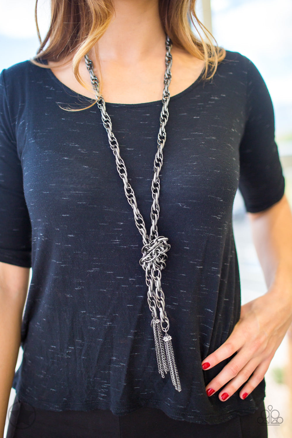 SCARFed for Attention - Gunmetal Scarf Necklace - Paparazzi Accessories - A single strand of spiraling, interlocking links with light-catching texture is anchored by two tassels of chain that add dramatic length to the piece. Undeniably the most versatile piece in Paparazzi's history, the scarf necklace features FIVE different ways to accessorize. Bejeweled Accessories By Kristie - Trendy fashion jewelry for everyone -