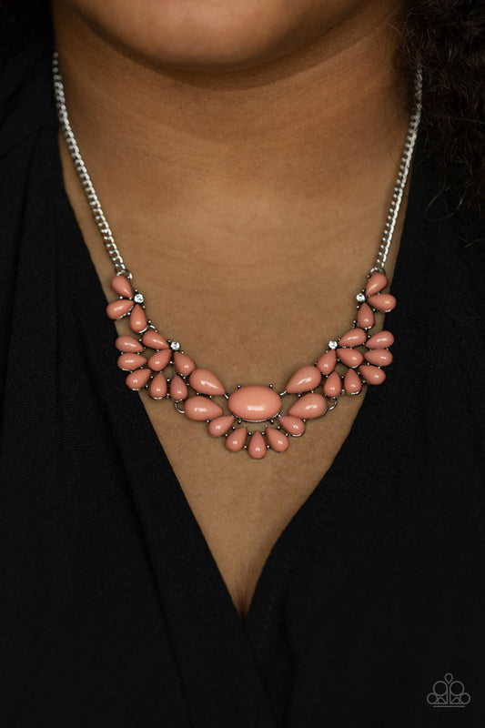 Secret Gardenista - Pink and Silver Necklace - Paparazzi Accessories - Teardrop Pale Rosette beads fan out from the bottoms of solitaire white rhinestones as they link below the collar, creating whimsically stacked frames. Featuring an oval center, oversized teardrop beads flare out from the centermost frame for a flirtatiously floral finish.