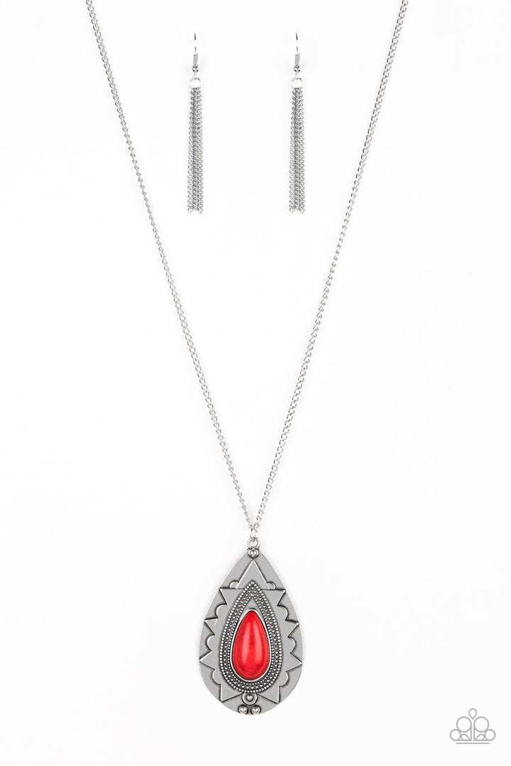 Sedona Solstice - Red Stone and Silver Necklace - Paparazzi Accessories - Chiseled into a tranquil teardrop, a fiery red stone is pressed into an ornate silver frame. The whimsical pendant swings from the bottom of a lengthened silver chain for a seasonal look.