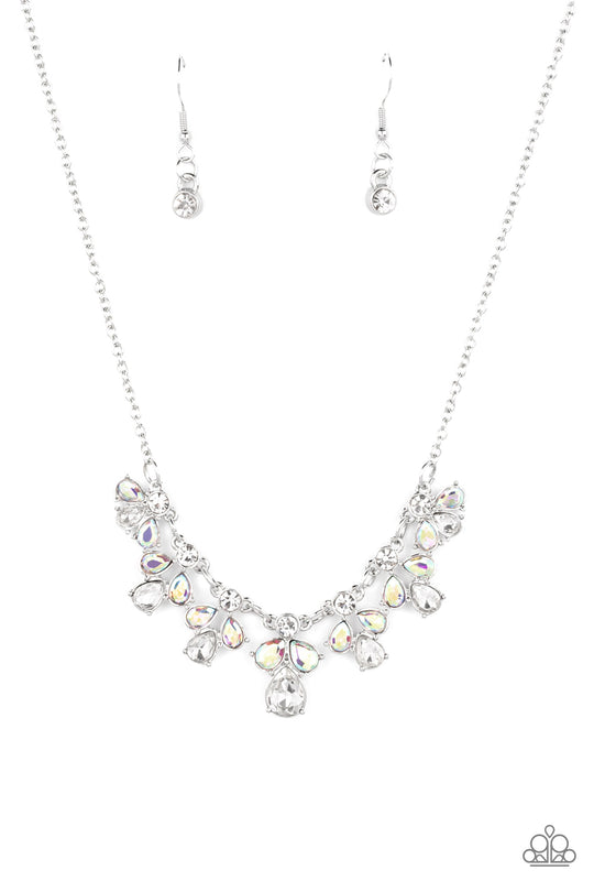 See in a New STARLIGHT - Multi and Silver Necklace - Paparazzi Accessories - Dainty white reflective gems, followed by a trio of iridescent and reflective teardrop gems vertically blaze down the collar, creating a starry shimmer. Due to its prismatic palette, color may vary. Features an adjustable clasp closure. Sold as one individual necklace.