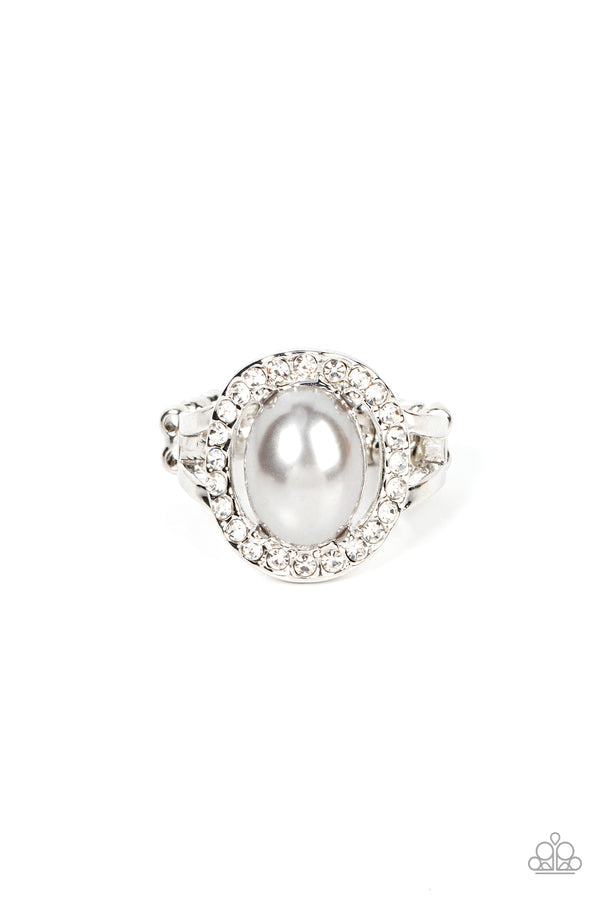 Seize the Shimmer - Silver Pearl Ring - Paparazzi Accessories - An oval silver pearl seemingly floats inside a glittery ring of white rhinestones atop layered bands of silver, resulting in a timeless centerpiece atop the finger. Features a dainty stretchy band for a flexible fit. Sold as one individual ring.