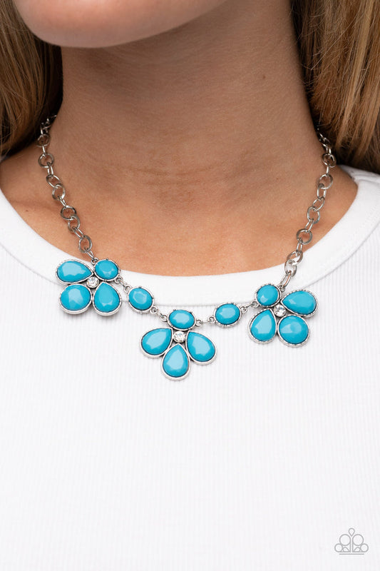 SELFIE-Worth - Blue and Silver Necklace - Paparazzi Accessories - Encased in textured silver fittings, oversized oval and teardrop blue beads delicately gather around glassy white rhinestone centers for a colorful floral look below the collar. Features an adjustable clasp closure. Sold as one individual necklace.
