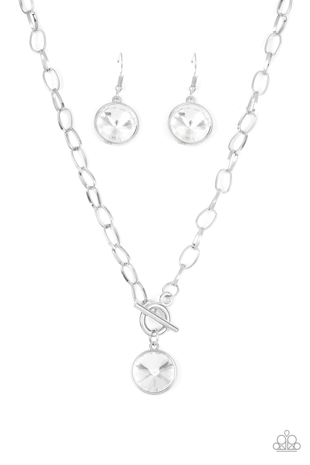 She Sparkles On - White and Silver Necklace - Paparazzi Accessories - A dramatic gem white swings from the bottom of a shiny silver chain, creating a blinding pendant below the collar. Features a toggle closure. Sold as one individual necklace.