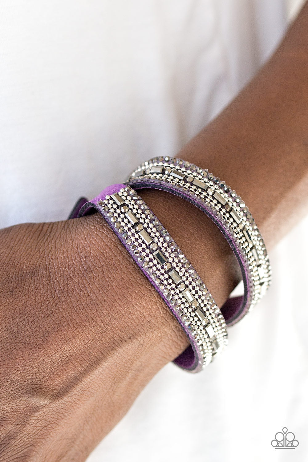 Shimmer and Sass - Purple Suede - Wrap and Snap Bracelet - Paparazzi Accessories - Featuring round and emerald style cuts, glassy hematite rhinestones are encrusted along a purple suede band. Rows of shimmery silver ball chain are pressed into the glittery band for a sassy finish. The elongated band allows for a trendy double wrap design. Features an adjustable snap closure.