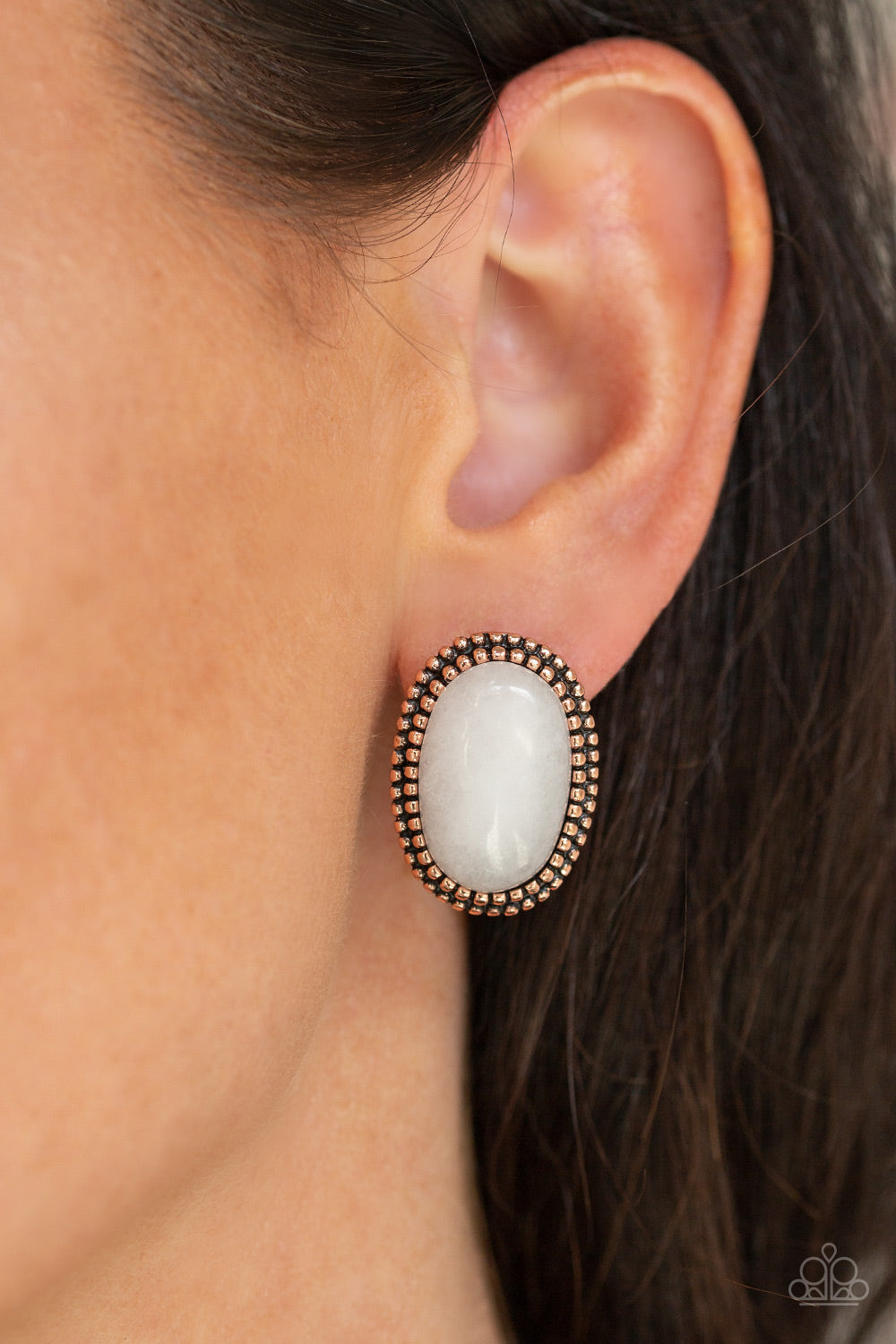 Shiny Sediment - Copper Post Earrings - Paparazzi Accessories - A studded copper frame spins around a glassy white stone, creating a whimsical frame. Earring attaches to a standard post fitting fashion earrings. Trendy fashion jewelry for everyone.