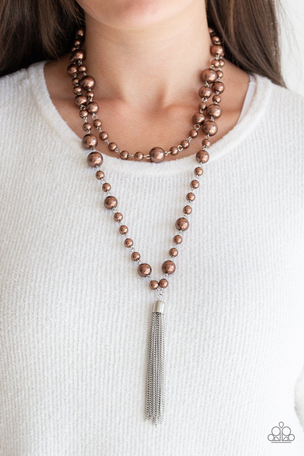 Social Hour - Brown Pearl Necklace - Paparazzi Accessories - Bubbly brown pearls link into two strands down the chest. A shimmery silver tassel swings from the lowermost strand, adding a timeless twist to the classic pearl fashion design. Features an adjustable clasp closure.
