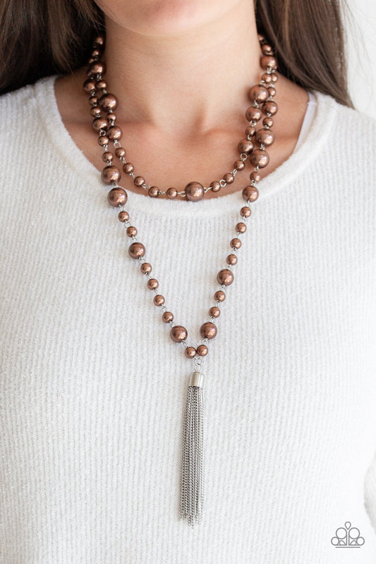 Social Hour - Brown Pearl Necklace - Paparazzi Accessories - Bubbly brown pearls link into two strands down the chest. A shimmery silver tassel swings from the lowermost strand, adding a timeless twist to the classic pearl fashion design. Features an adjustable clasp closure.