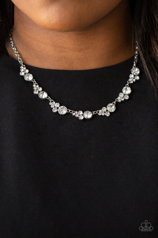 Social Luster - White and Silver Necklace - Paparazzi Accessories - A collection of glassy white rhinestones coalesce into glittery silver frames as they link below the collar for a timeless shimmer stylish fashion necklace.