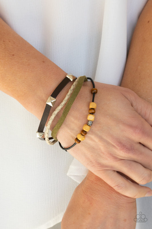 Solo Climb - Black Leather - Green and Brown Suede Bracelet - Paparazzi Accessories -  Infused with mismatched metal and wooden accents, rows of green and brown suede and leather cords layer across the wrist for a rugged look. Features an adjustable sliding knot closure.