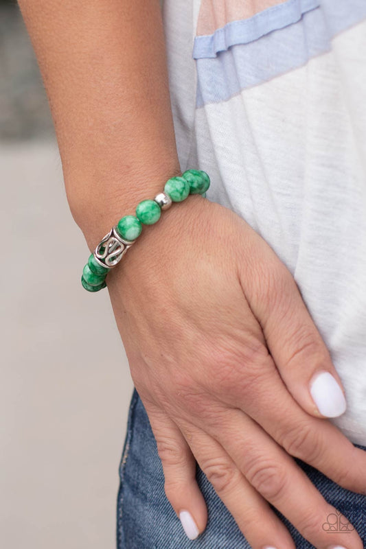 Soothes The Soul - Green Jade - Silver Bracelet - Paparazzi Accessories - Infused with an ornate silver centerpiece, an earthy collection of silver and jade beads are threaded along a stretchy band around the wrist for a seasonal flair. Sold as one individual bracelet.