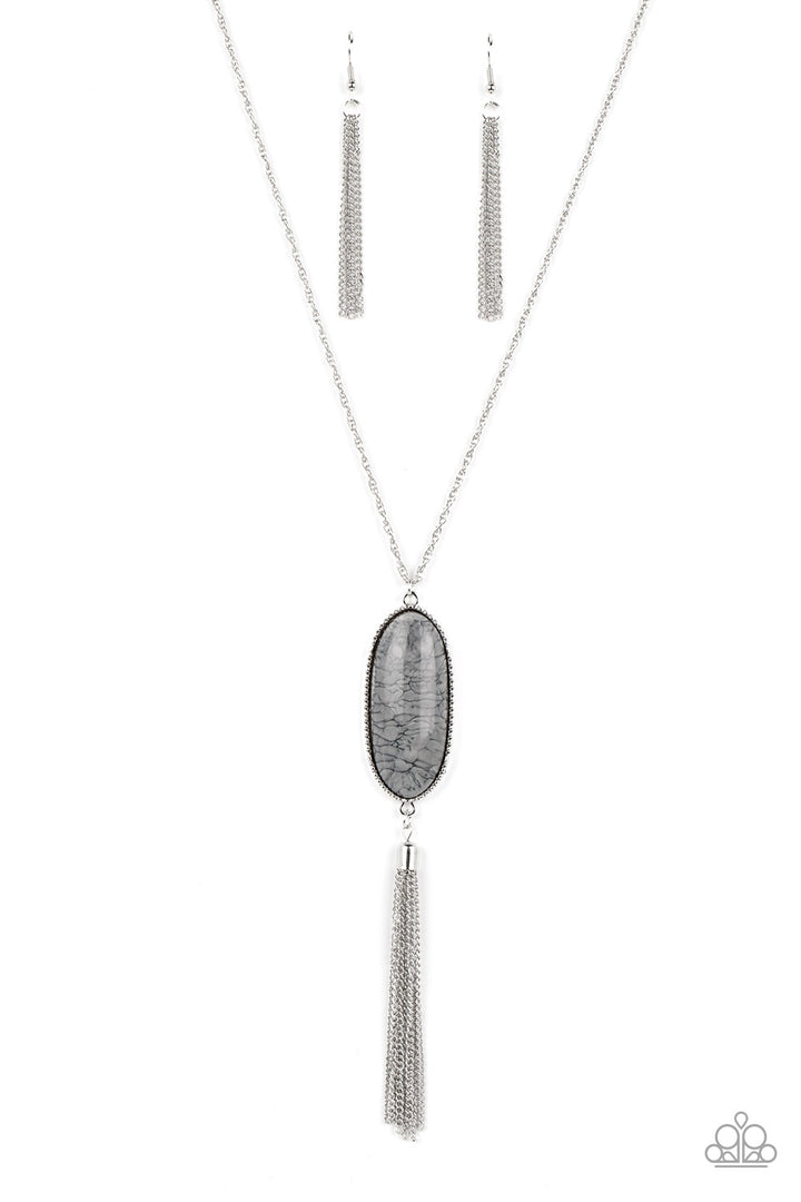 Southern Stroll - Silver Necklace - Paparazzi Accessories - Shimmery Northern Droplet lacquer-like paint swirls into a faux stone pattern inside of a glassy casing. The oblong pendant glides along a classic silver chain below the collar while a silver tassel dances from the bottom of the display, adding wanderlust movement to the whimsical piece. Features an adjustable clasp closure. Sold as one individual necklace.