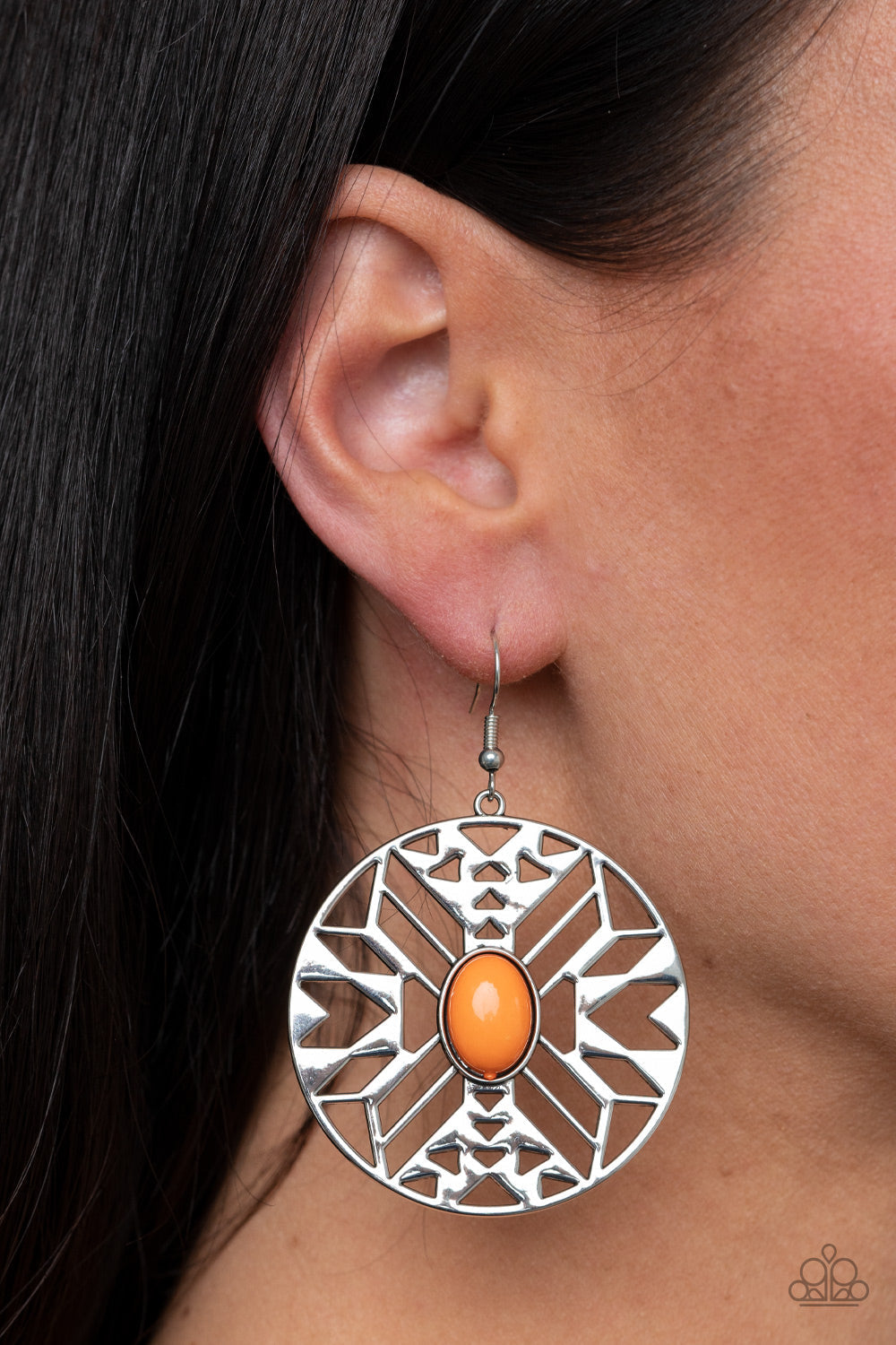 Southwest Walkabout - Orange and Silver Earrings - Paparazzi Accessories - An oval Amberglow bead adorns the center of a round silver frame radiating with an airy southwestern inspired pattern for a whimsical look. Earring attaches to a standard fishhook fitting. Sold as one pair of earrings.