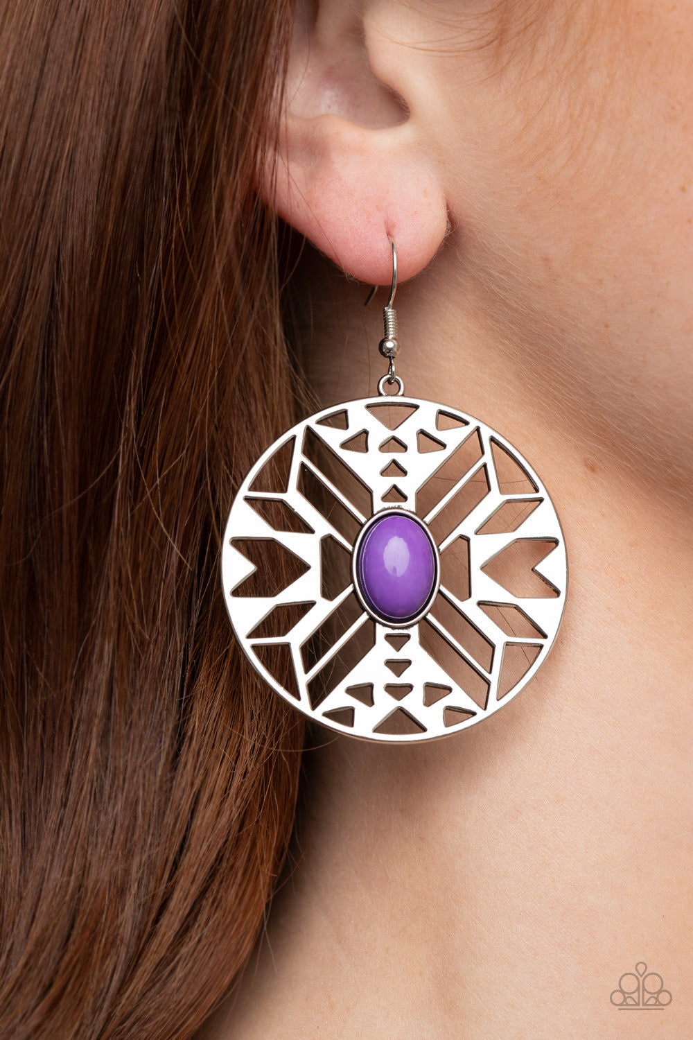 Southwest Walkabout - Purple and Silver Earrings Silver Earrings - Paparazzi Jewelry - Bejeweled Accessories By Kristie - An oval purple bead adorns the center of a round silver frame radiating with an airy southwestern inspired pattern for a whimsical look. Earring attaches to a standard fishhook fitting. Sold as one pair of earrings.