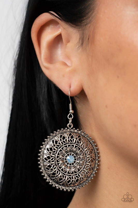 Spellbinding Botanicals - Blue and Silver - Floral Earrings - Paparazzi Accessories - Mandala-like petals layer and fan out from a dainty blue opal rhinestone center, blooming into an enchanting floral frame. Earring attaches to a standard fishhook fitting.