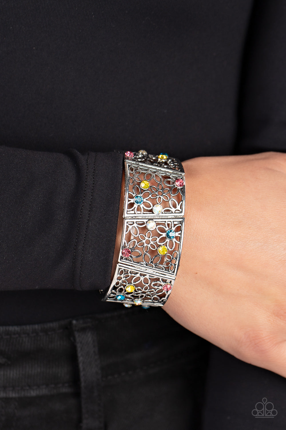 Spring Greetings - Multi Color and Silver Bracelet - Paparazzi Accessories - Multicolored and iridescent rhinestones, an airy daisy pattern blooms inside silver frames that are threaded along stretchy bands around the wrist.
