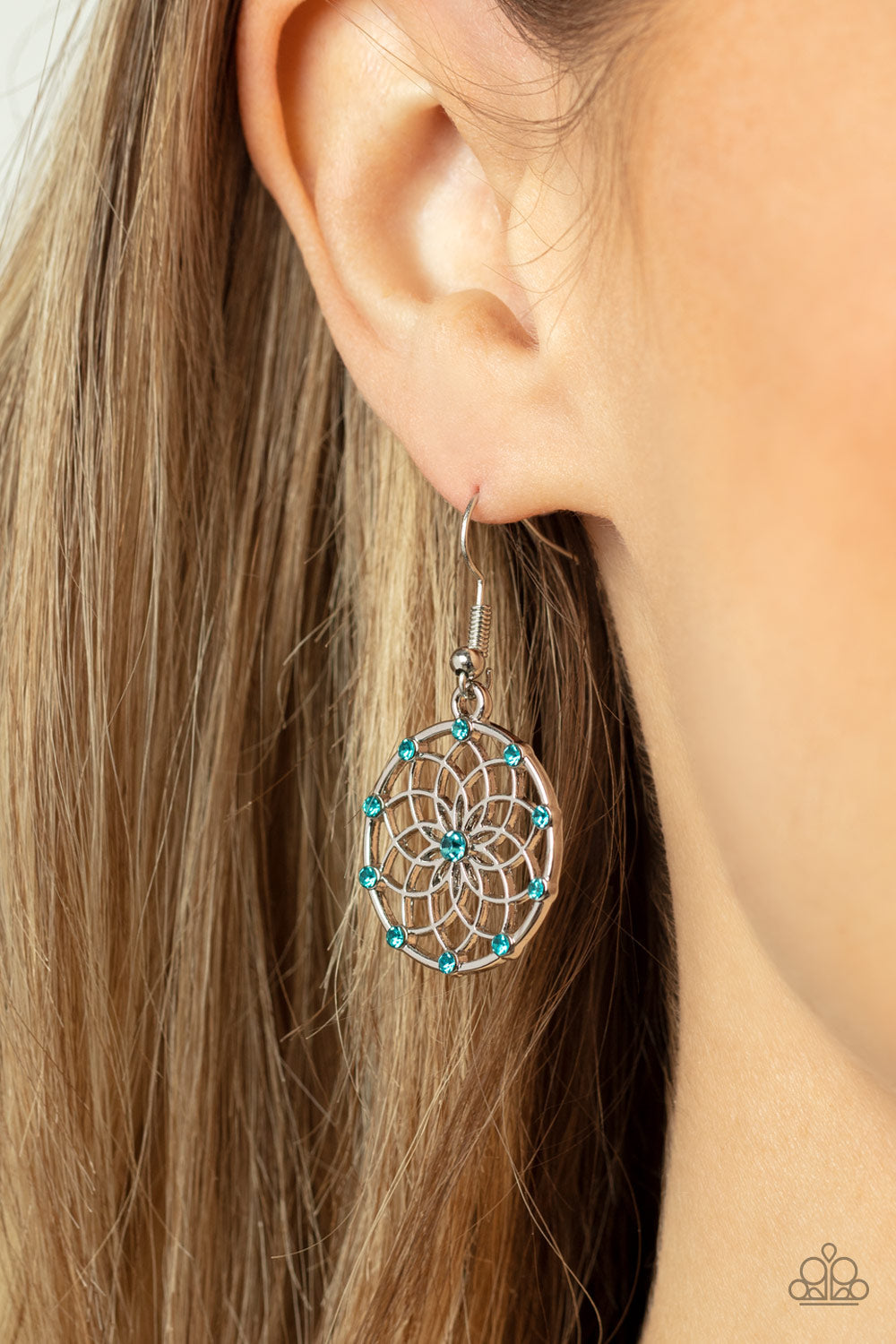 Springtime Salutations - Blue and Silver Earrings - Paparazzi Accessories - Dotted with dainty blue rhinestones, an airy mandala-like blossom blooms inside a silver hoop for a seasonal shimmer. Earring attaches to a standard fishhook fitting. 