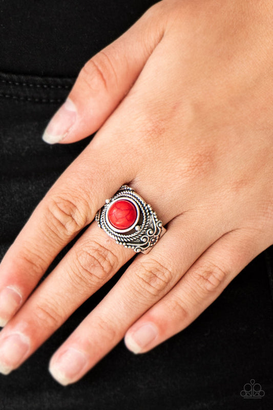 Stand Your Ground - Red and Silver Ring - Paparazzi Accessories - A fiery red stone is pressed into an ornate silver band radiating with rope-like and studded textures for a seasonal look. Features a stretchy band for a flexible fit fashion ring.