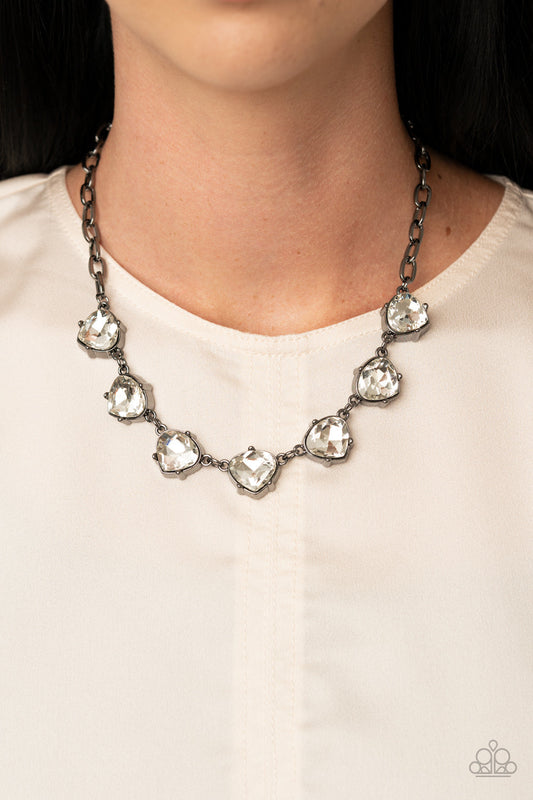 Star Quality Sparkle - Black - Gunmetal Fashion Necklace - Paparazzi Accessories - Attached to an oversized gunmetal chain, faceted white teardrop frames delicately connect below the collar for a glamorous look. Features an adjustable clasp closure.