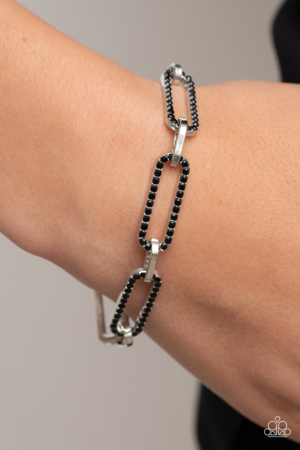 Still Not OVAL You - Black and Silver Bracelet - Paparazzi Accessories - Dotted in dainty black rhinestones, oblong silver frames link with shiny silver fittings around the wrist for a timeless twinkle. Features an adjustable clasp closure. Sold as one individual bracelet.